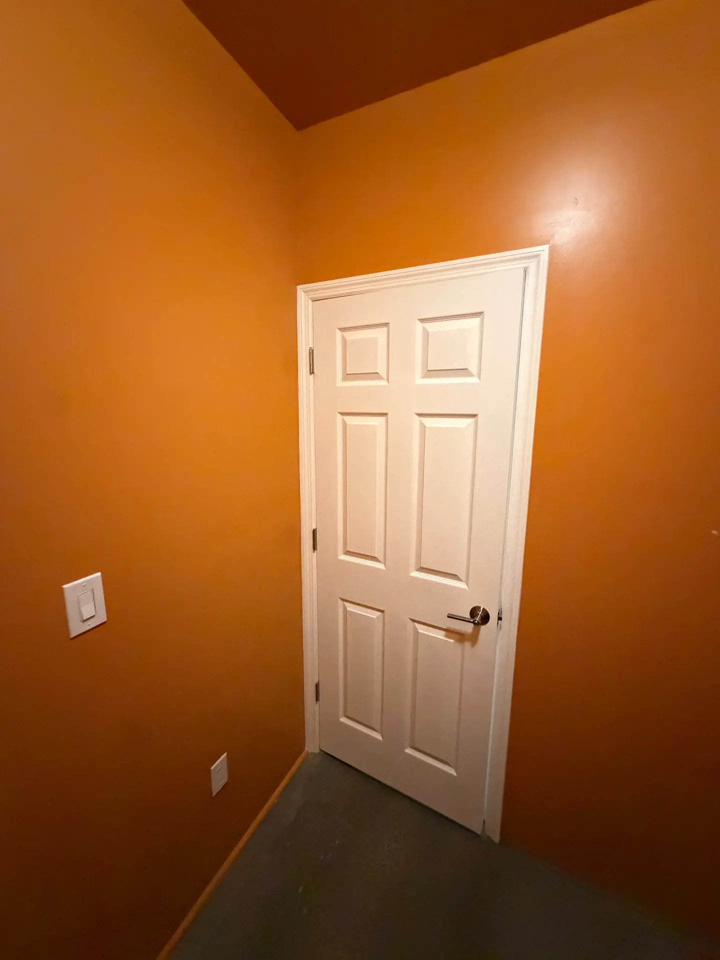 The Orange Room interior at RISE, a quiet private office with warm orange walls